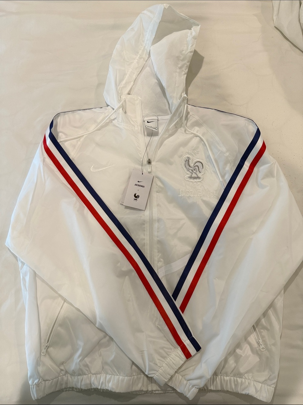 Jacquemus White Hooded Windbreaker with Red & Blue Stripes